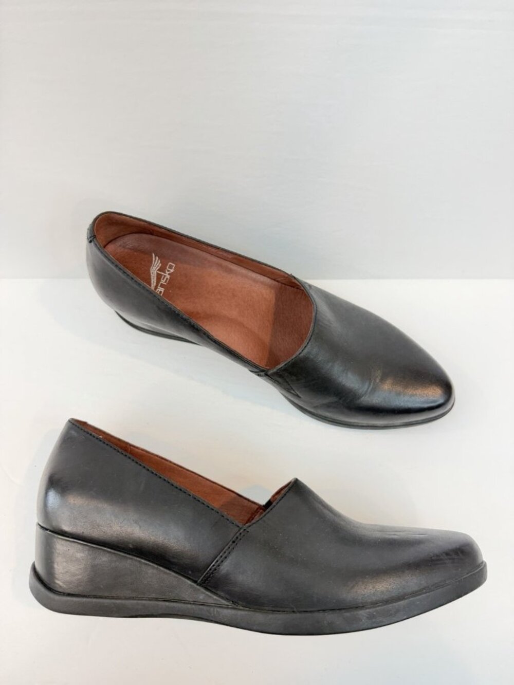 Dansko Black Leather Slip-On Wedge Loafers
